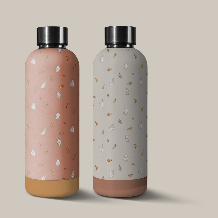 illustration pattern on coral and cream background of orange leaves and tiny white crystals scattered loosely and clean. pattern applied on water bottles mockups.