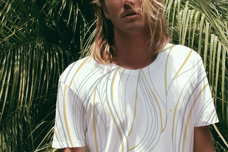 Blonde surfer boy with white printed shirt