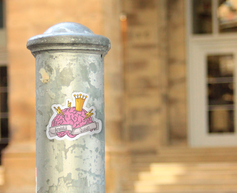 Anxiety Queen Sticker Etsy Shop. Pink Brain illustration with crown and lightning.
