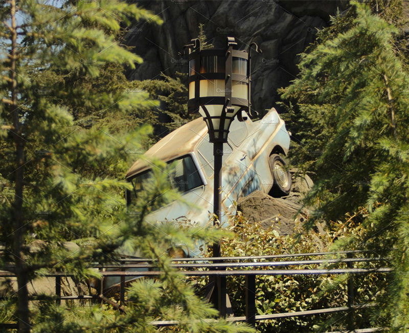 Harry Potter themed park, Weasley's Family car, Ford Anglia, parked and crashed on a square, Universal Studios Park.